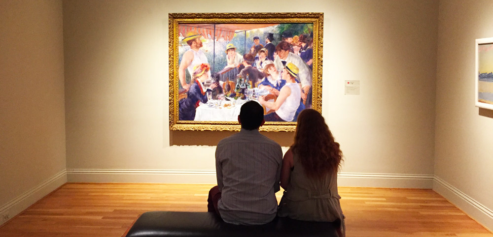 Paar Anzeigen von Renoirs Mittagessen der Bootsparty in der Phillips Collection - Washington, DC