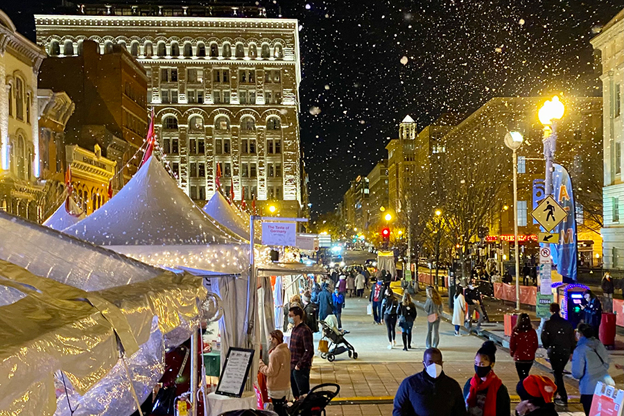 Holiday market with snow falling