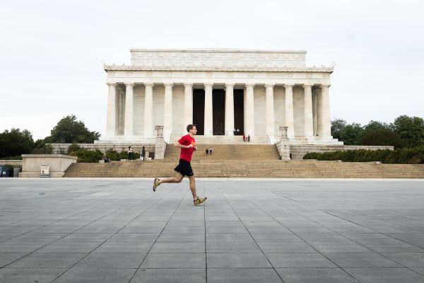 Person running in front of Lincoln Memorial