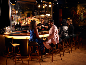 Couple dining at bar 