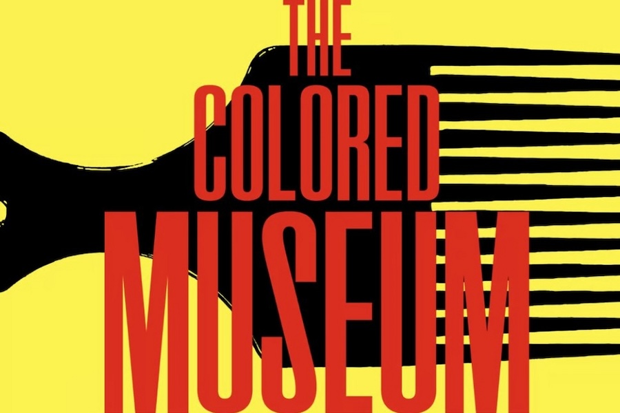 A poster for 'The Colored Museum' featuring bold red text on a yellow background, with a stylized black comb partially visible behind the title.