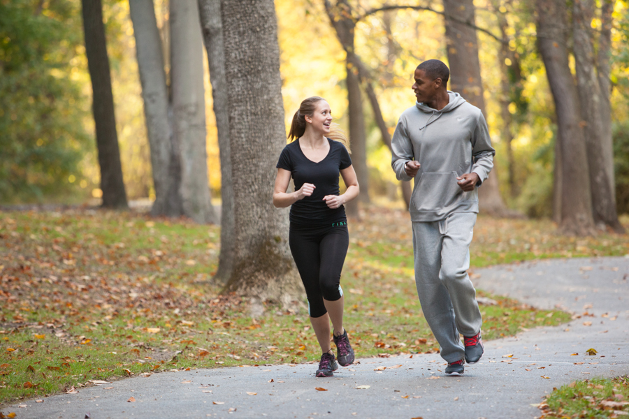 Couple Running Through Rock Creek Park 