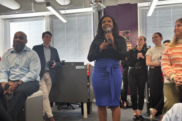 AEF Intern Makayla Cruz speaks at a team retreat 