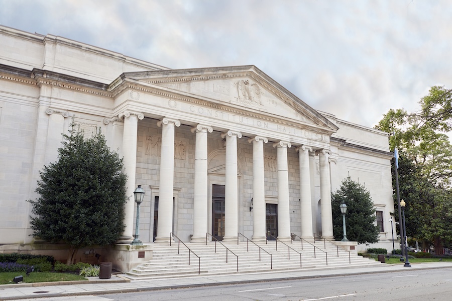 Exterior shot of the DAR Constitution Hall, with grand columns out front. 