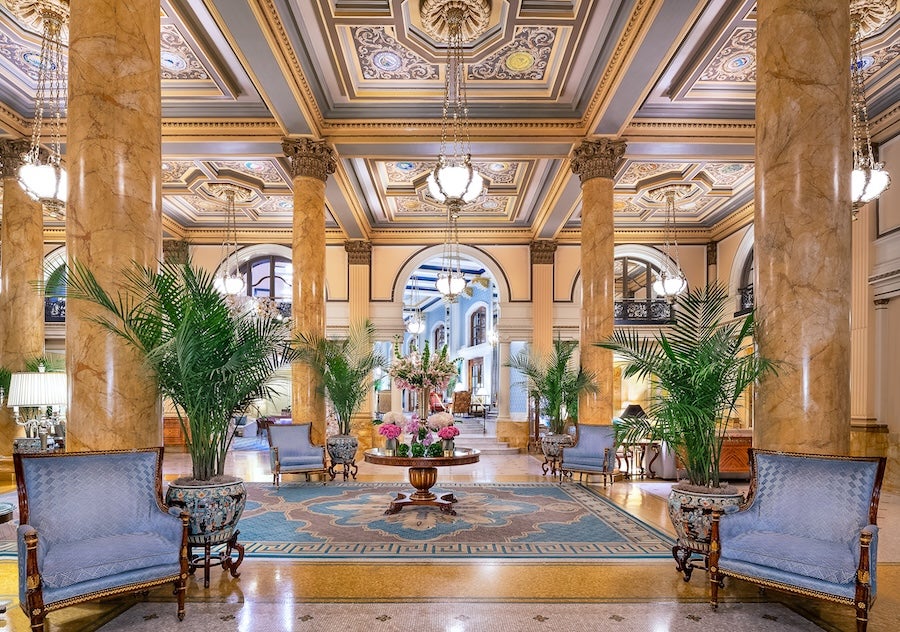 The Willard InterContinental lobby features soaring marble columns, ornate ceilings and elegant seating arrangements.