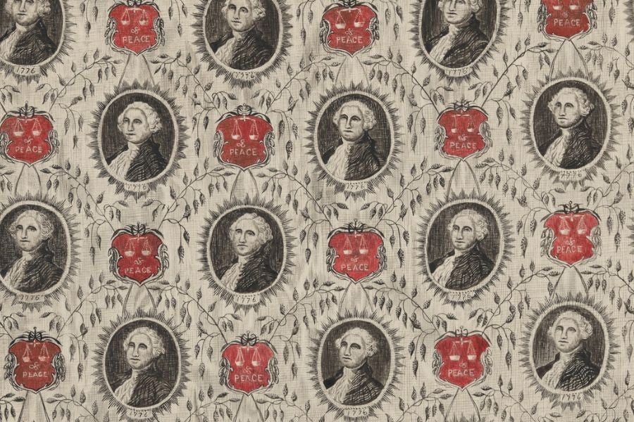 Decorative textile pattern featuring repeated portraits of George Washington surrounded by floral motifs and red emblems labeled “Peace” and dated 1776.