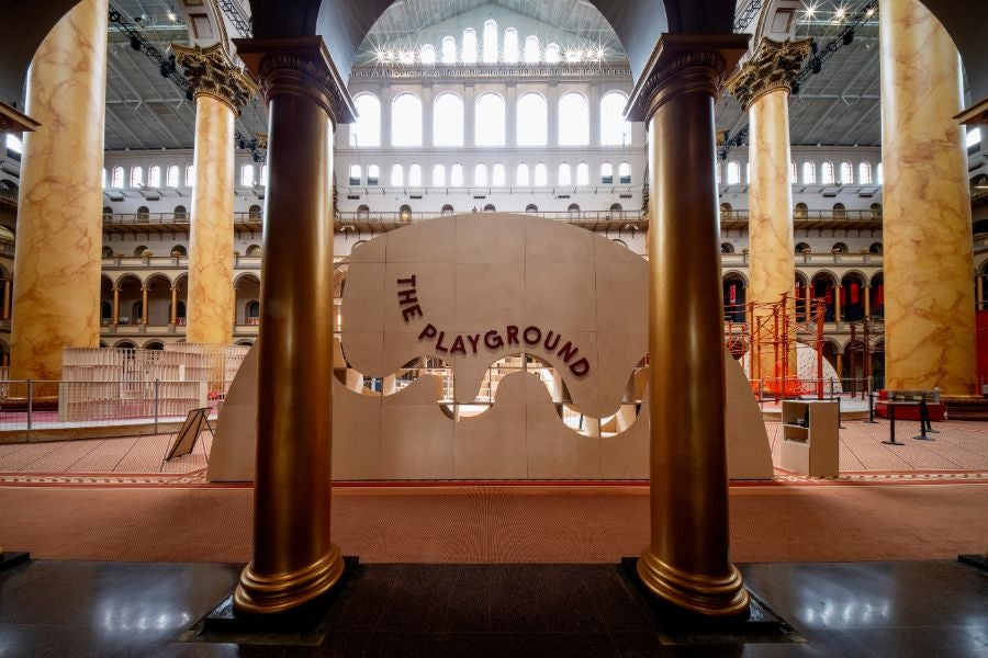 Entrance to the National Building Museum’s PLAYGROUND exhibition inside the museum’s Great Hall, framed by its iconic marble columns.