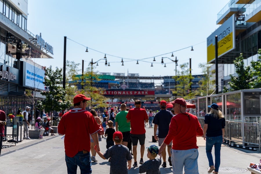 A family walking towards Nationals Park in Navy Yard 