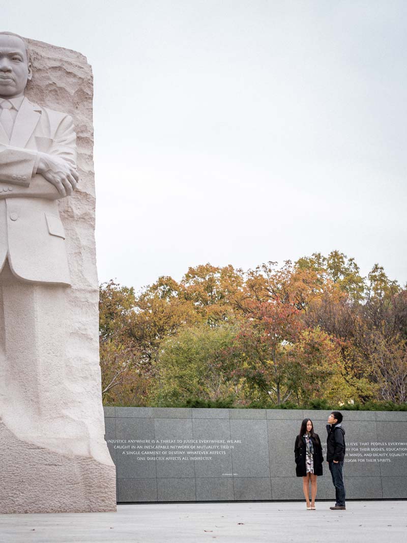 Couple looking at the Martin Luther King, Jr. Memorial on the National Mall - Romantic sites and landmarks in Washington, DC