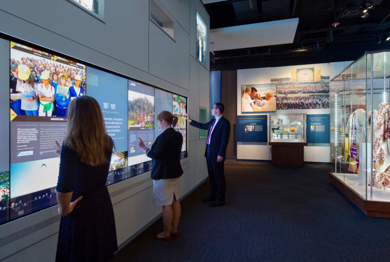 Visitors using interactive display at the Saint John Paul II National Shrine - Things to do in DC's Brookland neighborhood