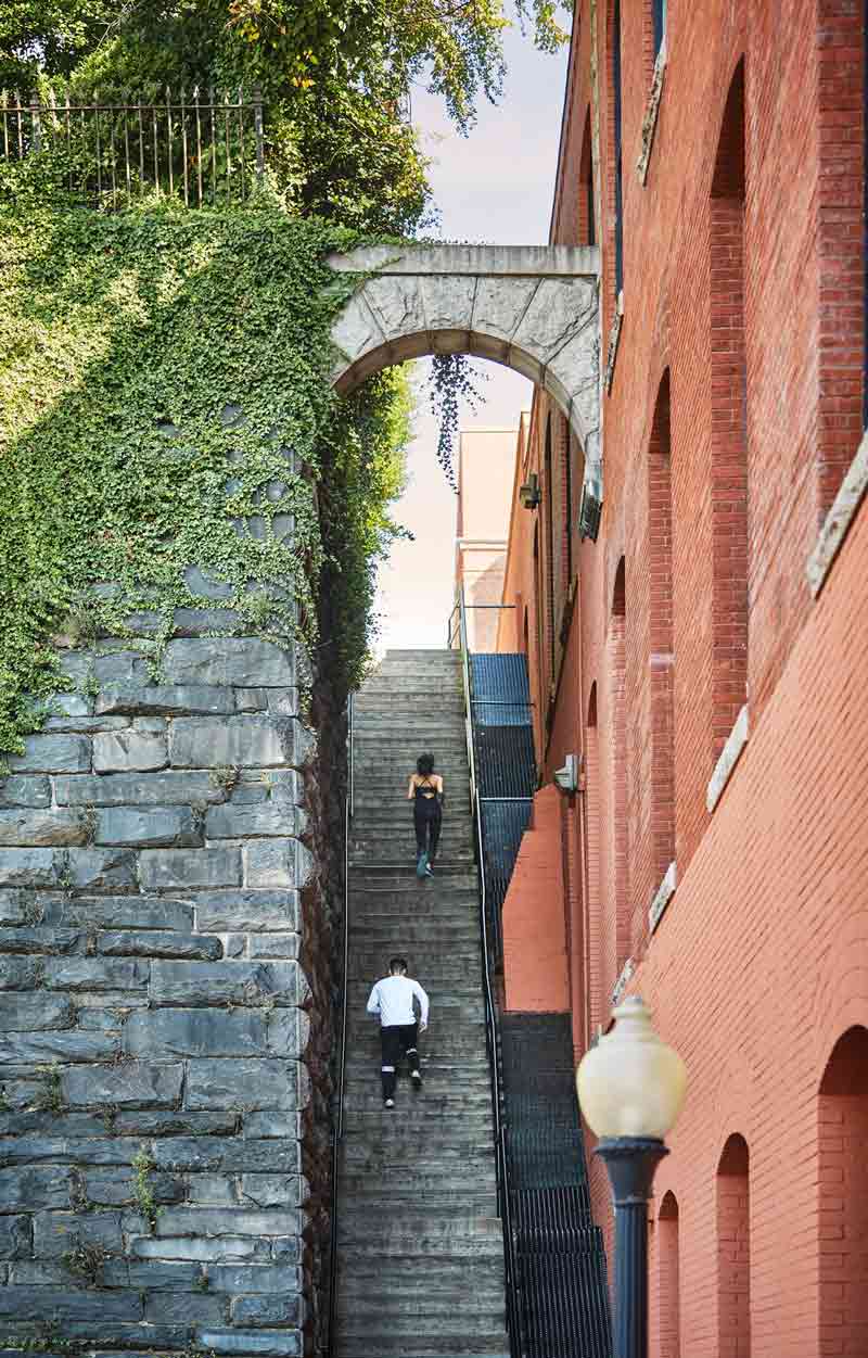 Runners going up The Exorcist Steps in Georgetown - Free outdoor activity and landmark in Washington, DC