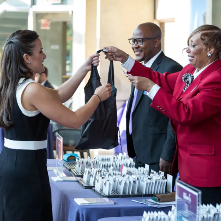 Destination DC Staffing Services redcoat assisting meeting attendee - Staffing solutions for events in Washington, DC
