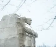 The Martin Luther King Jr. Memorial stands majestic with a light covering of snow in Washington, DC.