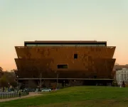 The National Museum of African American History and Culture in Washington, DC, at sunset.