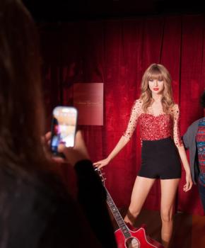 Visitors taking photo with Taylor Swift figure at Madame Tussauds Washington, DC - Kid-friendly museum in Washington, DC