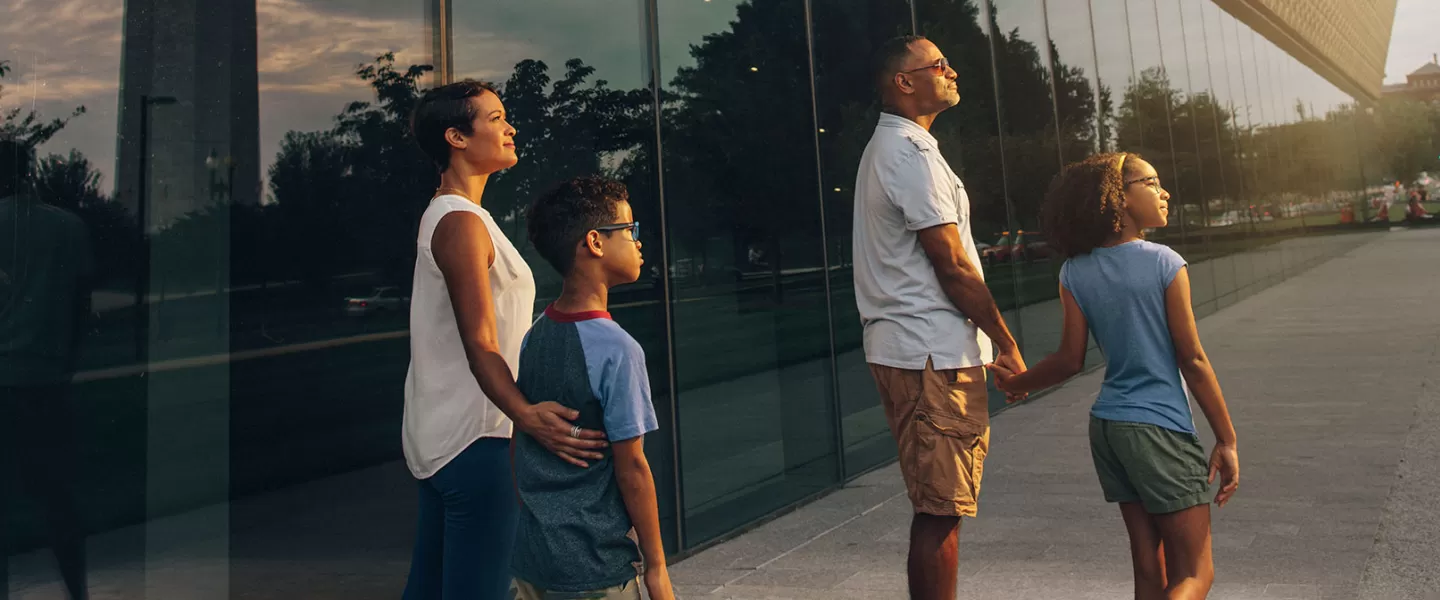 Family outside of the National Museum of African American History and Culture