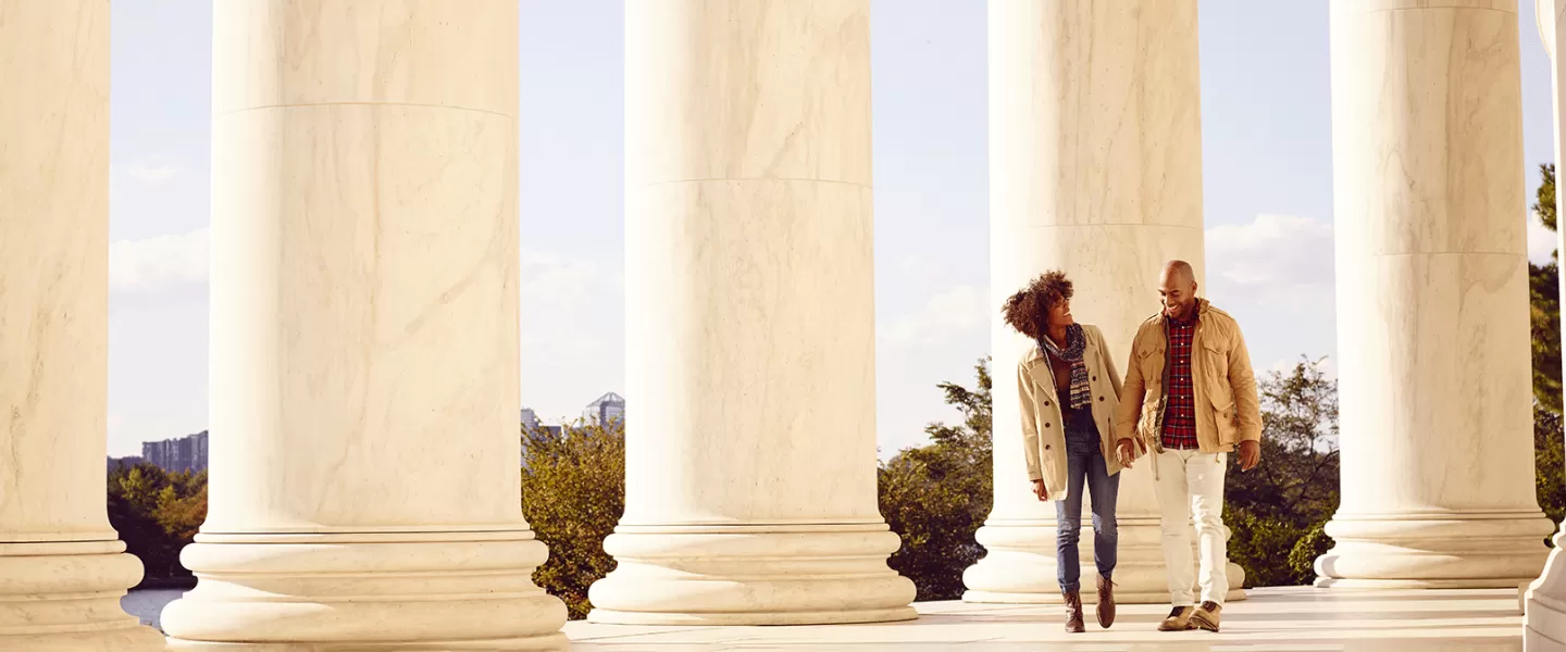 Couple strolling at Jefferson Memorial