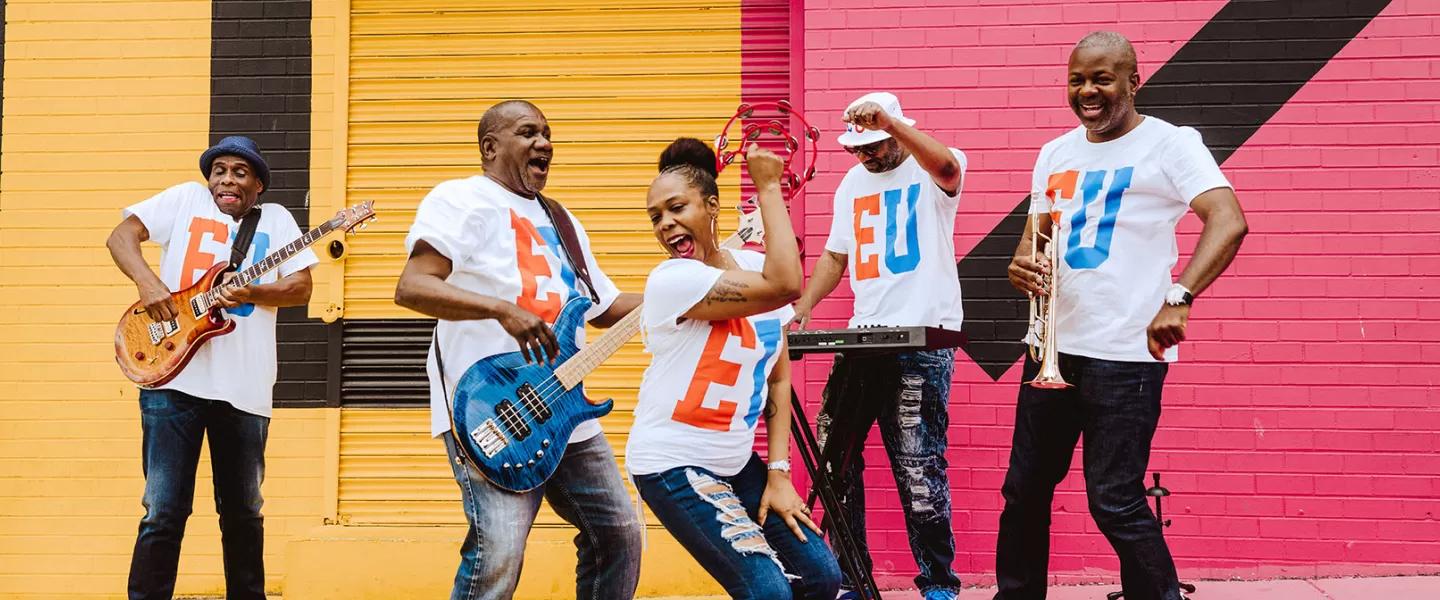 Band preforming in front of DC Mural