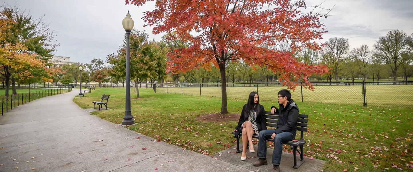 People on bench on national mall 