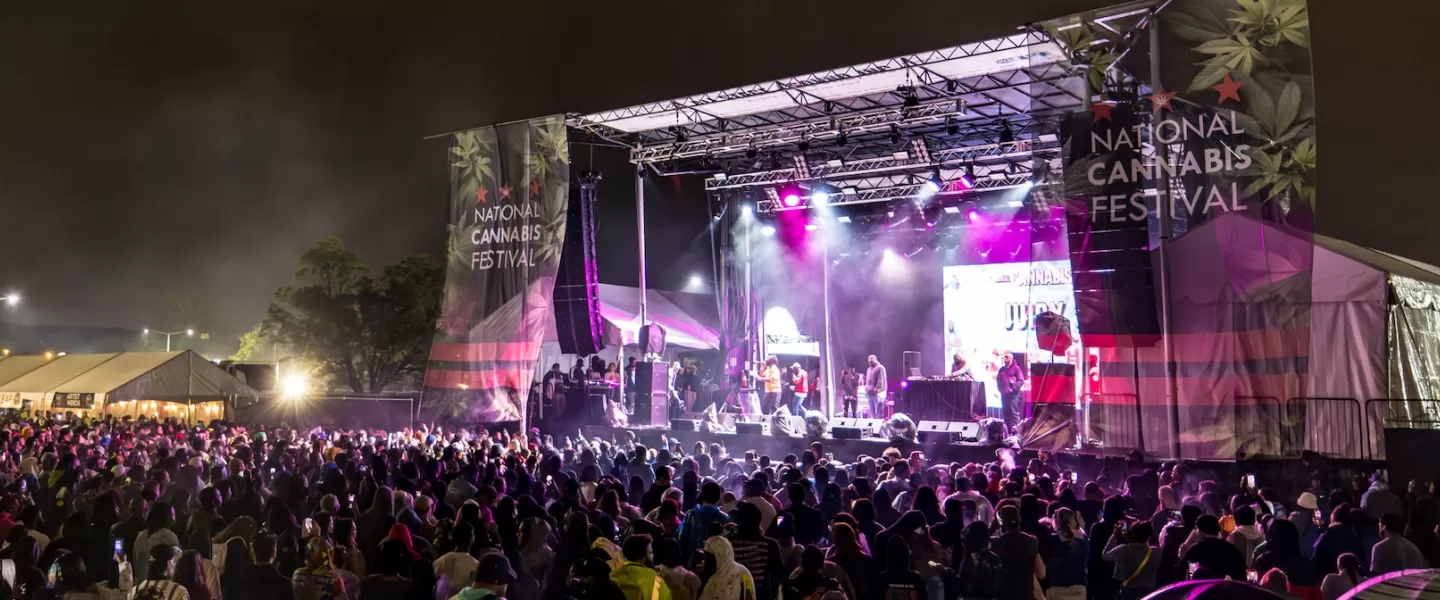 An exciting concert setup with bright purple spotlights. 