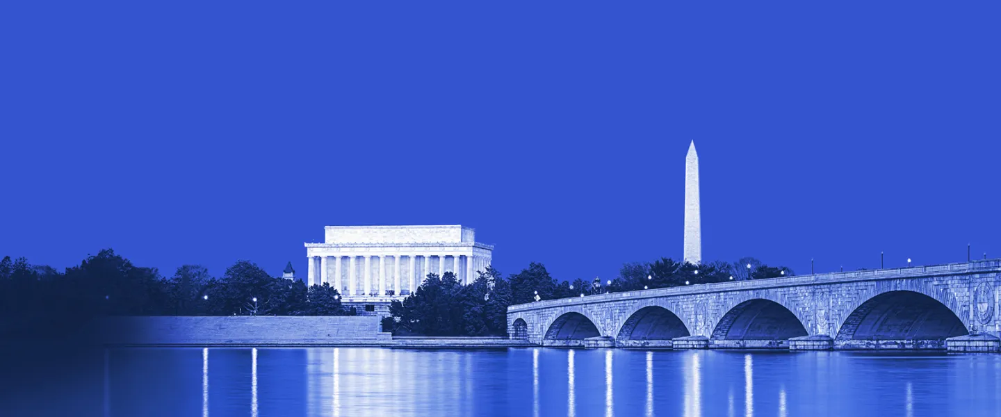 Night photo of the Lincoln Memorial and Washington Monument across the Potomac River