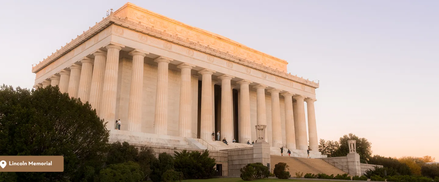 A view of the Lincoln Memorial at an angle with the sunlight at dawn