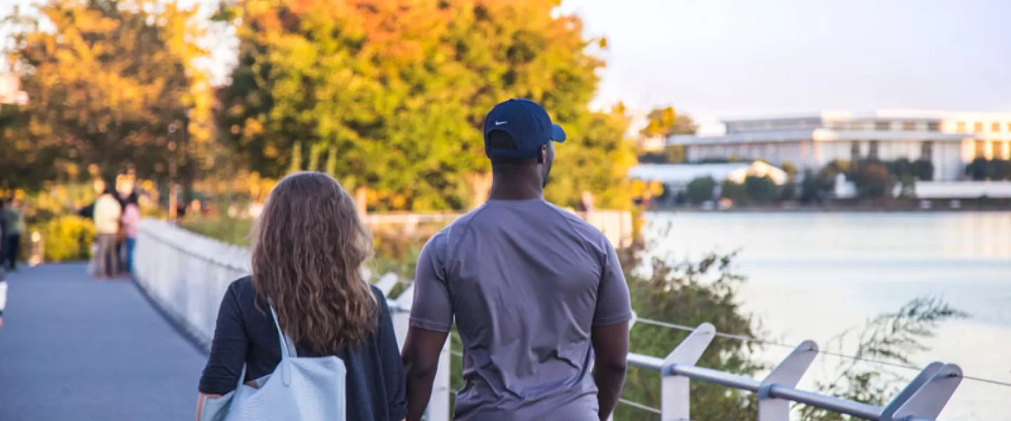 Couple walking along theGeorgetown Waterfront - Romantic spots in Washington, DC