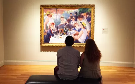 Paar Anzeigen von Renoirs Mittagessen der Bootsparty in der Phillips Collection - Washington, DC
