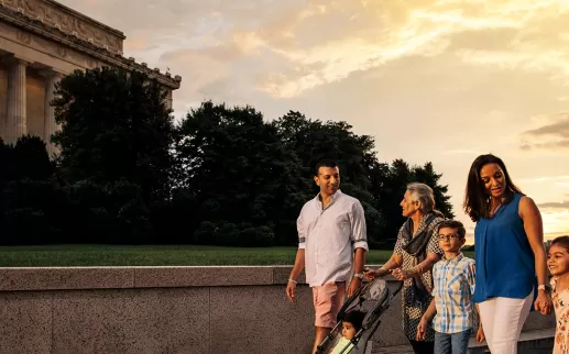 Family strolling by Lincoln Memorial

