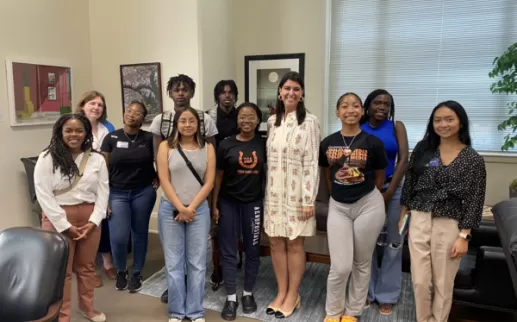 A group of students stand with DC Councilwoman Brooke Pinto

