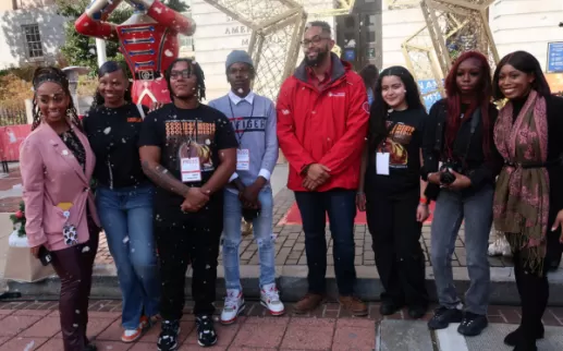 Students from Coolidge High School Media conduct interviews at the Downtown Holiday Market
