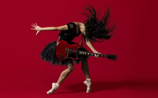 Picture of Woman strumming guitar and dancing ballet
