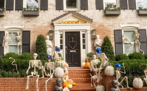 Skeletons and pumpkins decorate the front of a historic home in Georgetown. 