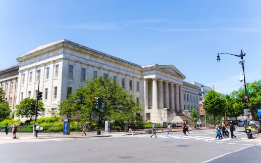 The exterior of the Smithsonian American Art Museum and National Portrait Gallery on a sunny day in DC.R