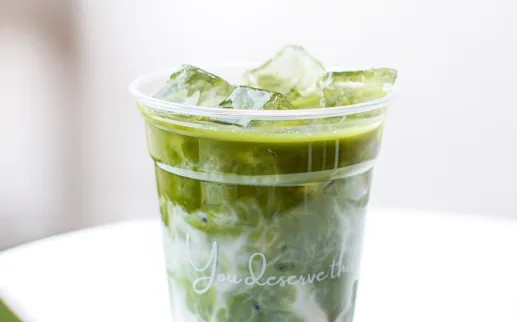 A to-go cup of silky matcha and ice.