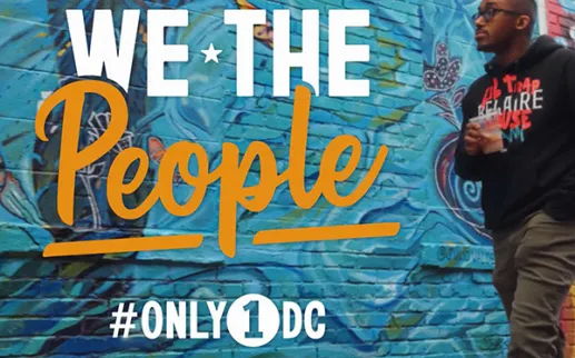 Chef Anthony Jones standing by mural, alongside “We The People” graphic
