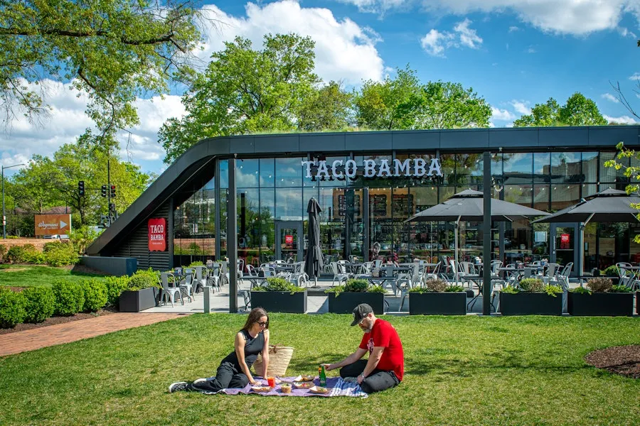 green lawn outside of Taco Bamba with two pincers