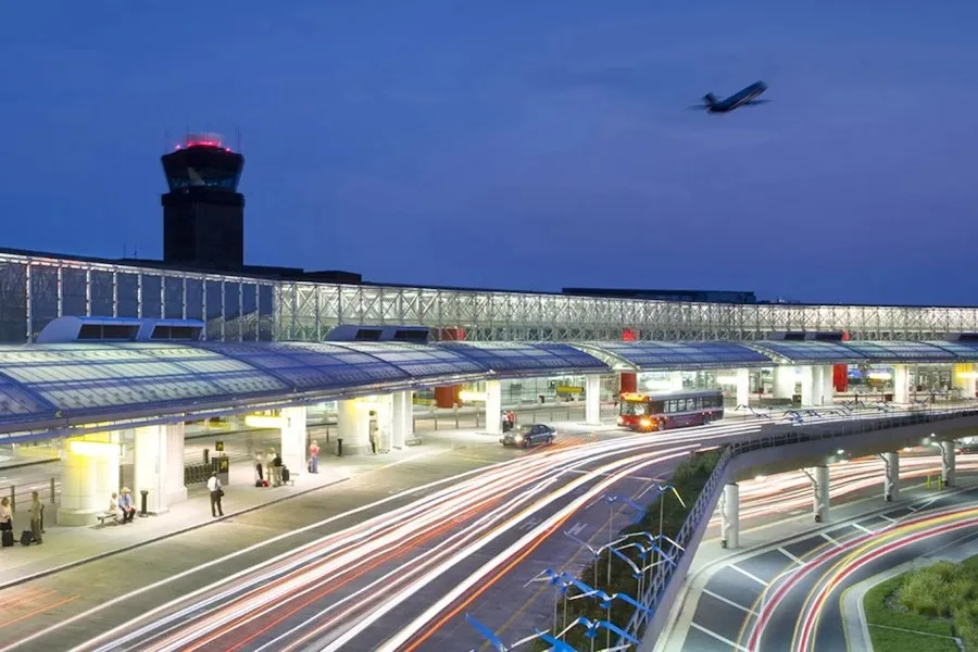 BWi airport pick up with plane taking off and the control tower