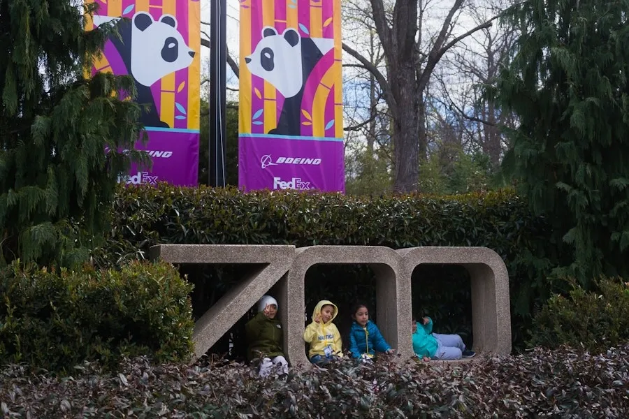 Kids pose for a photo out front of the National Zoo. 