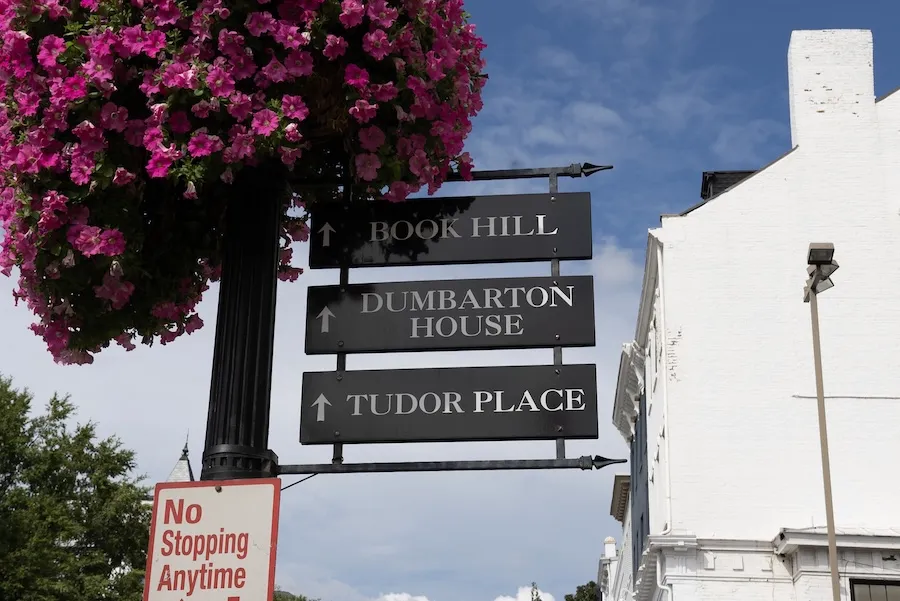 Tudor Place signpost with pink flowers