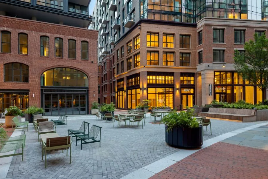 Modern apartment courtyard with patio seating and planters