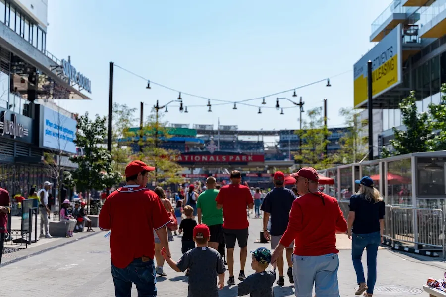 A family walking towards Nationals Park in Navy Yard 