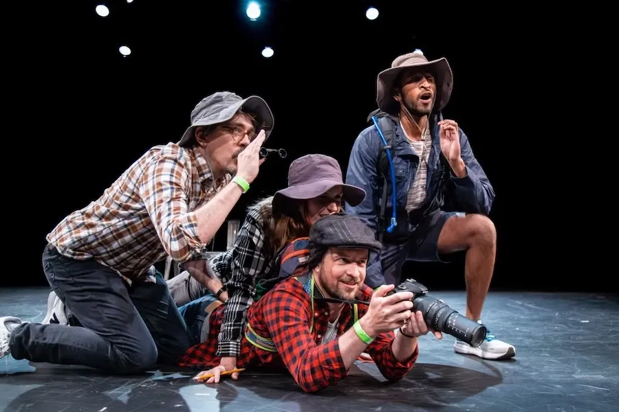 Improv actors performing on stage at Washington Improv Theater