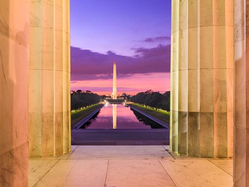 view of the Washington Monument and Reflecting Pool from the Lincoln Memorial with pretty sunset colors