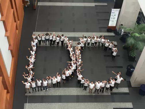 DDC Staff standing in the shape of the letters DC