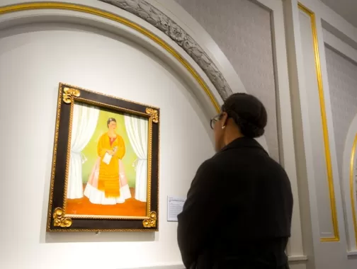 A woman gazes at a self portrait of Frida Kahlo at the National Museum of Women in the Arts.