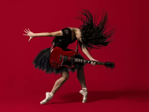 Picture of Woman strumming guitar and dancing ballet