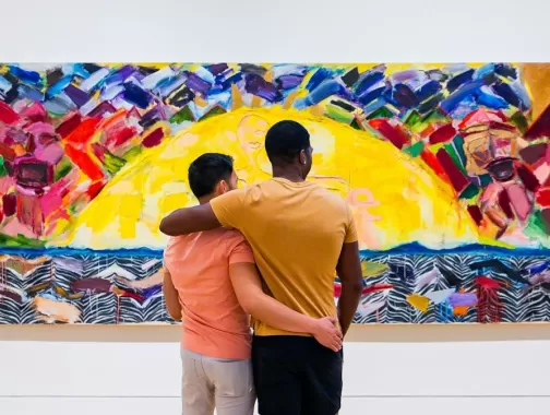 A couple looks at a colorful painting at the Phillips Collection.