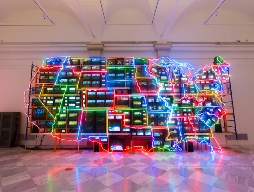 The colorful neon and video installation “Electronic Superhighway” by Nam June Paik glows inside the Smithsonian American Art Museum.