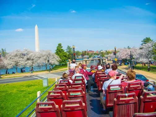 people on big bus touring the city